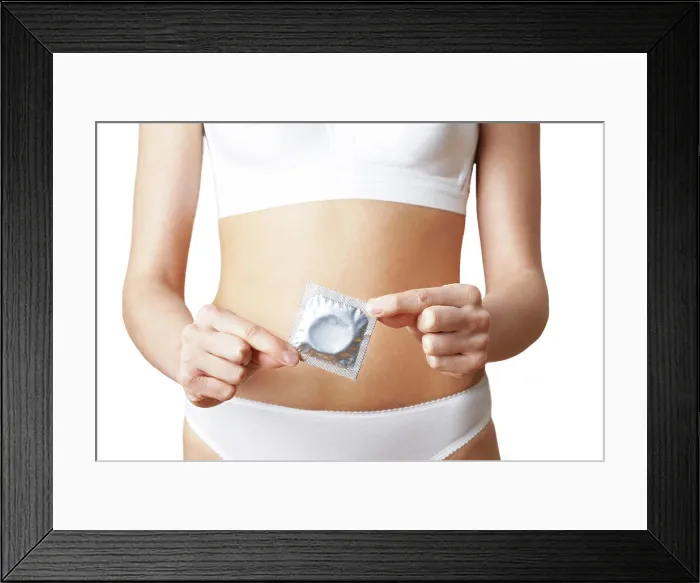 Framed Print : Close up Of Woman In Underwear Holding Condom Framed Print : Close up Of Woman In Underwear Holding Condom