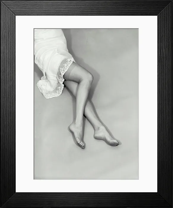Framed Print : Vintage photograph. Waist down photo of woman in white nightgown with bare feet and legs. Model released Framed Print : Vintage photograph. Waist down photo of woman in white nightgown with bare feet and legs. Model released