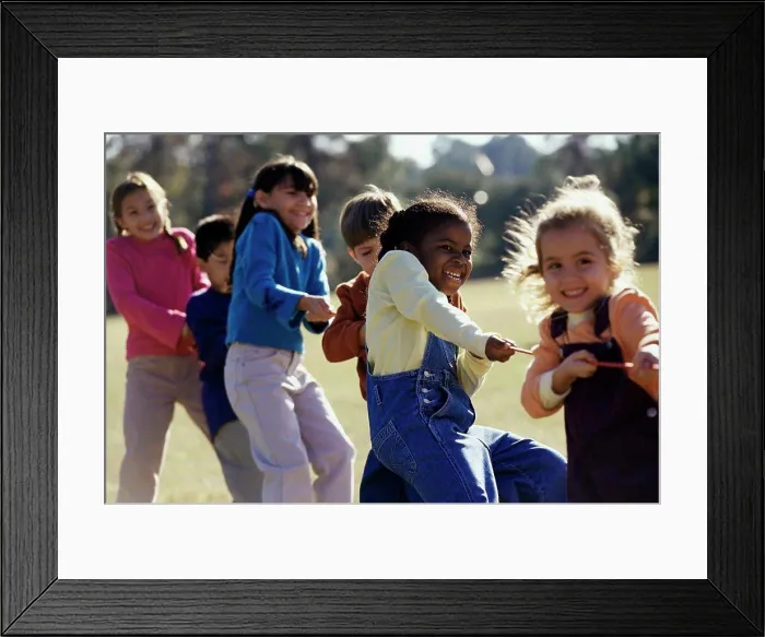 Framed Print : Group of children playing tug-of-war Framed Print : Group of children playing tug-of-war