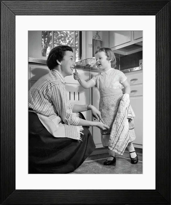 Framed Print : 1950s LITTLE GIRL AND MOTHER IN KITCHEN BOTH WEARING APRONS GIRL HOLDING DISH TOWEL GESTURING TO MOTHER Framed Print : 1950s LITTLE GIRL AND MOTHER IN KITCHEN BOTH WEARING APRONS GIRL HOLDING DISH TOWEL GESTURING TO MOTHER