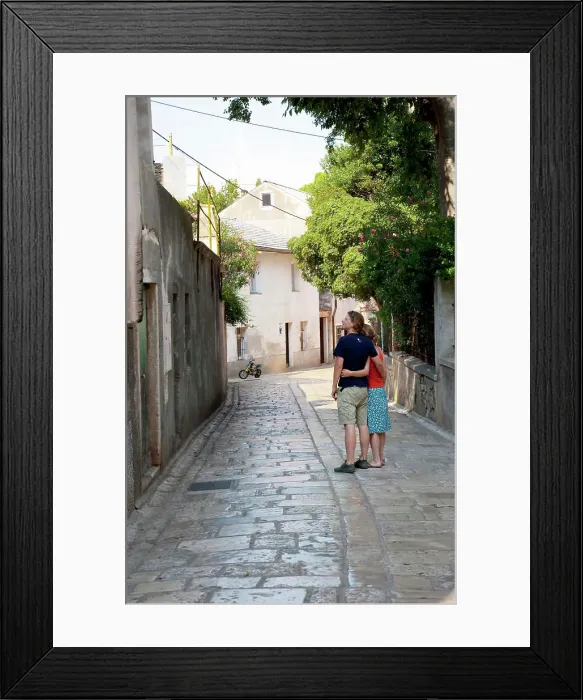 Framed Print : Cres, Coatia - Young couple stopped on a walkway in an Old World town. (MR) Framed Print : Cres, Coatia - Young couple stopped on a walkway in an Old World town. (MR)