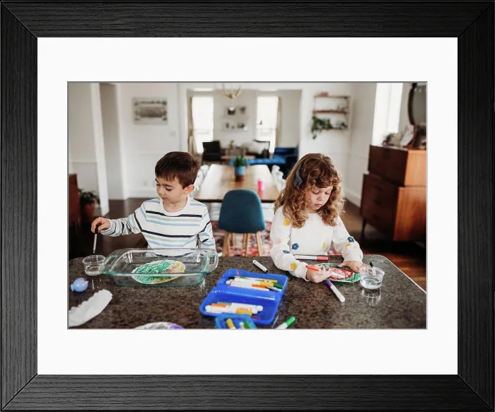 Framed Print : Young brother and sister coloring with markers at kitchen counter Framed Print : Young brother and sister coloring with markers at kitchen counter