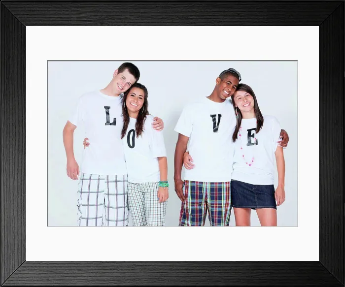 Framed Print : teenage couples with their t_shirts spelling ´love´
