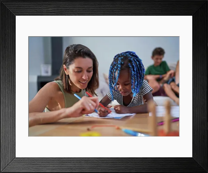 Framed Print : Mother and toddler daughter coloring at home Framed Print : Mother and toddler daughter coloring at home