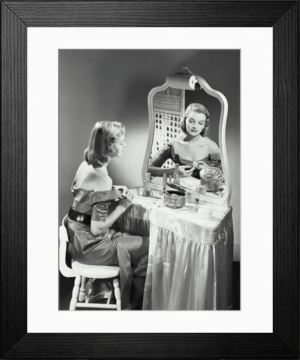 Framed Print : Vintage photograph. woman getting ready at vanity