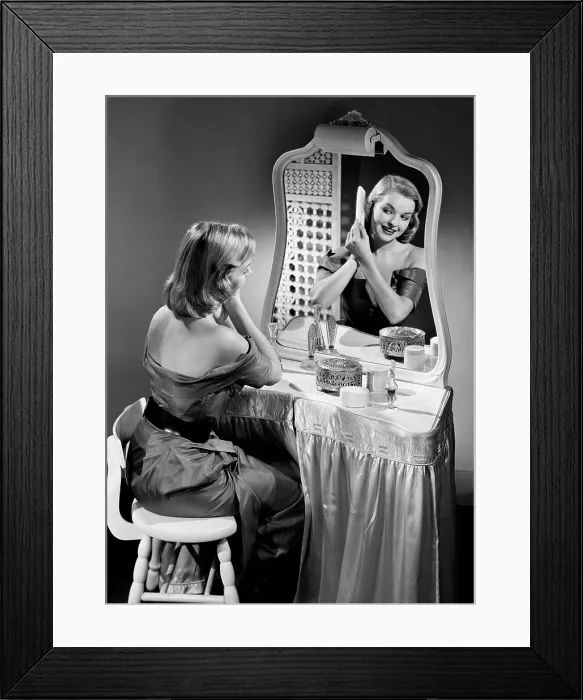 Framed Print : Portrait of beautiful woman combing hair in front of mirror Framed Print : Portrait of beautiful woman combing hair in front of mirror