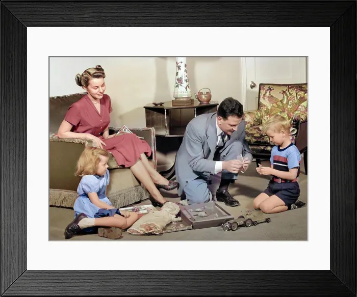 Framed Print : 1940s FAMILY MOTHER AND DAUGHTER WATCHING FATHER AND SON TOGETHER IN LIVING ROOM PLAYING WITH AND ASSEMBLING TOY Framed Print : 1940s FAMILY MOTHER AND DAUGHTER WATCHING FATHER AND SON TOGETHER IN LIVING ROOM PLAYING WITH AND ASSEMBLING TOY