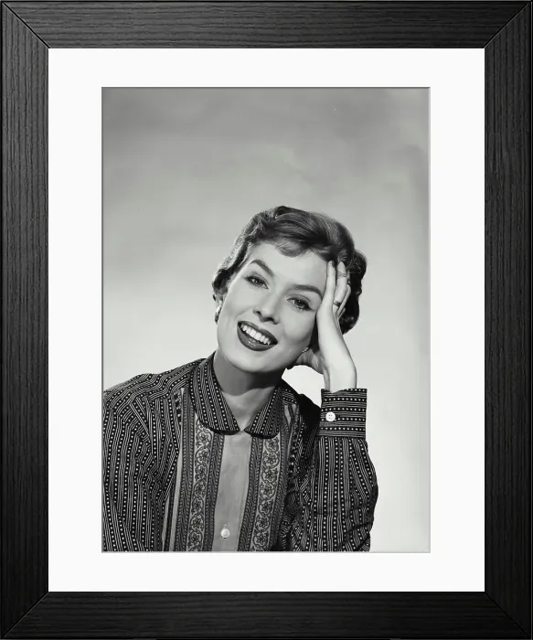 Framed Print : Vintage Photograph. Smiling woman with short hair wearing blouse with floral designs and stripes resting head on hand Framed Print : Vintage Photograph. Smiling woman with short hair wearing blouse with floral designs and stripes resting head on hand
