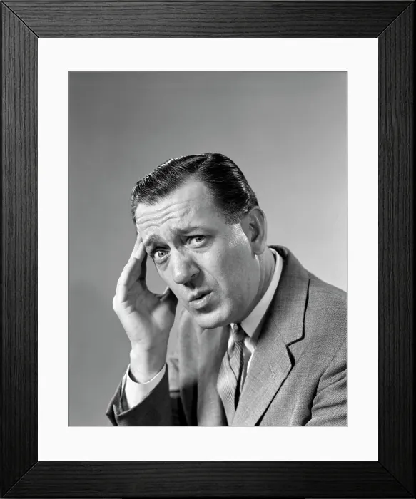 Framed Print : 1960S Portrait Man In Suit And Tie With Wrinkled Brow Wincing And Holding Forehead Looking At Camera Framed Print : 1960S Portrait Man In Suit And Tie With Wrinkled Brow Wincing And Holding Forehead Looking At Camera