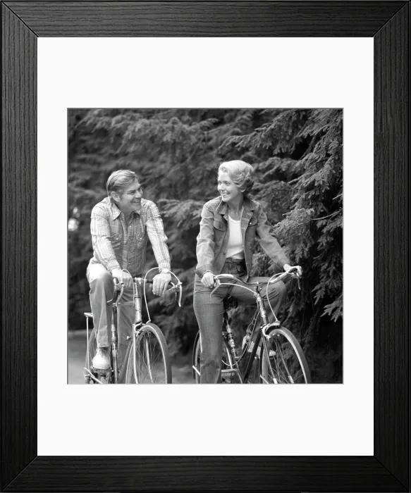 Framed Print : 1970S Happy Smiling Active Mature Middle-Aged Couple Riding Bicycles Bikes Pine Wooded Trail Activity Sports Retire