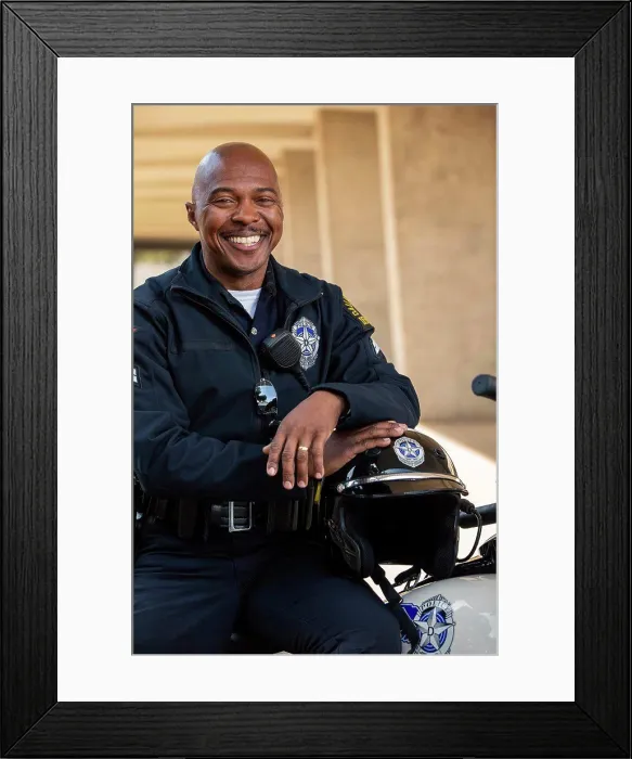 Framed Print : Portrait of Police officer sitting on his motorcycle outside looking towards camera smiling Framed Print : Portrait of Police officer sitting on his motorcycle outside looking towards camera smiling