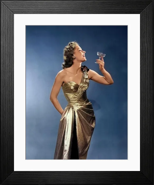 Framed Print : 1950s WOMAN WEARING METALLIC EVENING GOWN HOLDING UP WINE GLASS PROFILE Framed Print : 1950s WOMAN WEARING METALLIC EVENING GOWN HOLDING UP WINE GLASS PROFILE