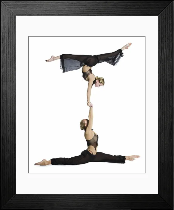 Framed Print : Female contortionist duo performing Framed Print : Female contortionist duo performing