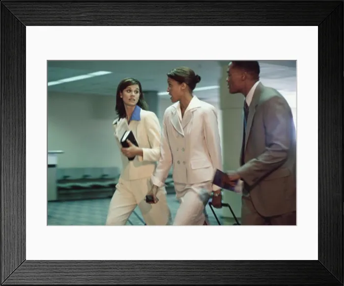 Framed Print : Side profile of business executives walking together Framed Print : Side profile of business executives walking together