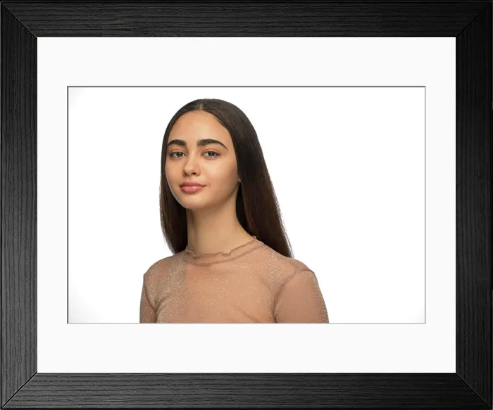 Framed Print : Portrait of young woman of Latin descent looking at camera with slight smile Framed Print : Portrait of young woman of Latin descent looking at camera with slight smile