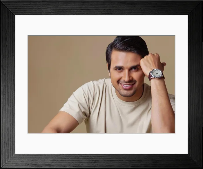 Framed Print : Portrait of handsome young man smiling over colored background