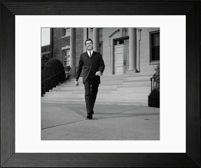 Framed Print : Businessman walking from courthouse Framed Print : Businessman walking from courthouse
