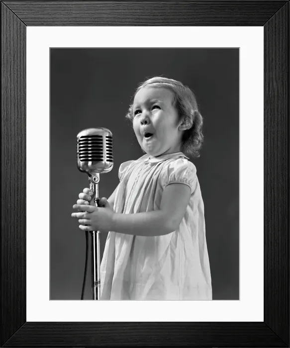 Framed Print : 1940S Little Girl Making Face Singing Into Microphone Framed Print : 1940S Little Girl Making Face Singing Into Microphone