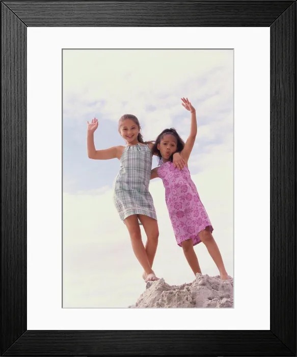 Framed Print : Portrait of two girls standing on the beach Framed Print : Portrait of two girls standing on the beach