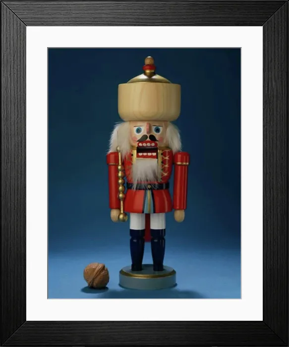 Framed Print : Close-up of a nutcracker with a walnut beside it Framed Print : Close-up of a nutcracker with a walnut beside it