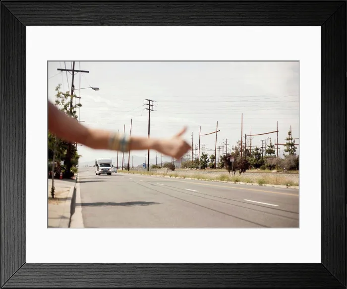 Framed Print : Hand of female hailing a ride during sunny day Framed Print : Hand of female hailing a ride during sunny day