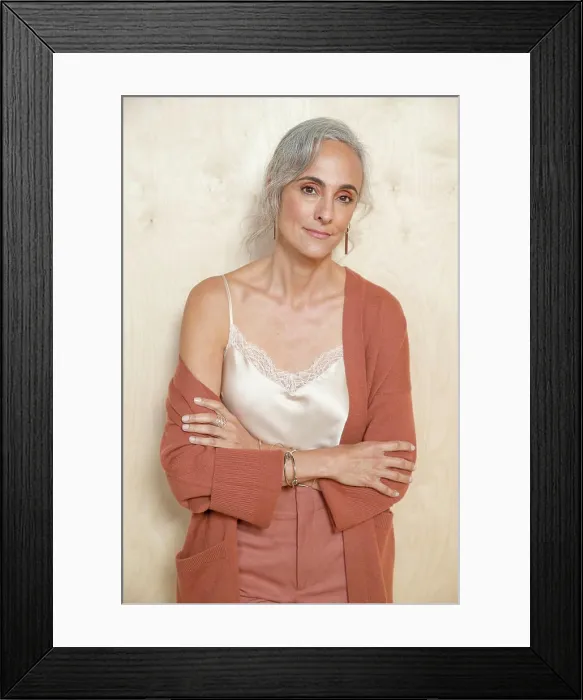 Framed Print : Calmly, a middle-aged woman with gray hair looks into camera Framed Print : Calmly, a middle-aged woman with gray hair looks into camera