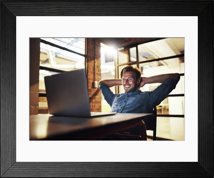 Framed Print : Employee, man and laid back on laptop at night with smile for email Framed Print : Employee, man and laid back on laptop at night with smile for email