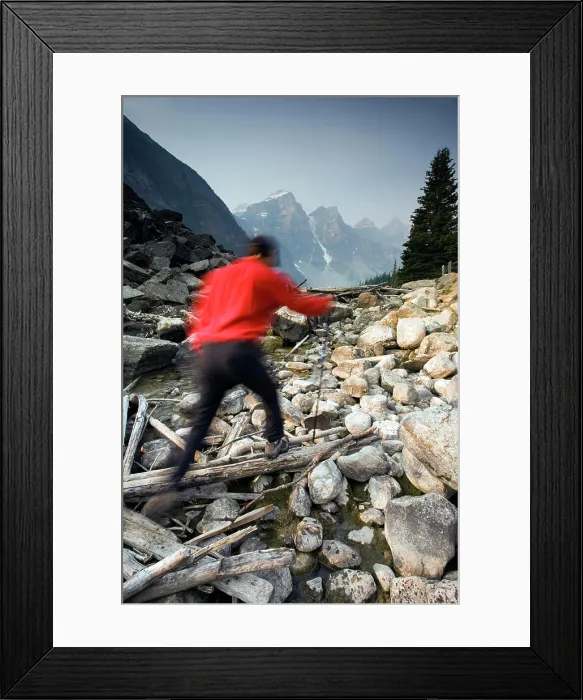 Framed Print : Hiker on Moraine Creek with Wenkchemna mountain range background, Banff National Park, Alberta, Canada Framed Print : Hiker on Moraine Creek with Wenkchemna mountain range background, Banff National Park, Alberta, Canada