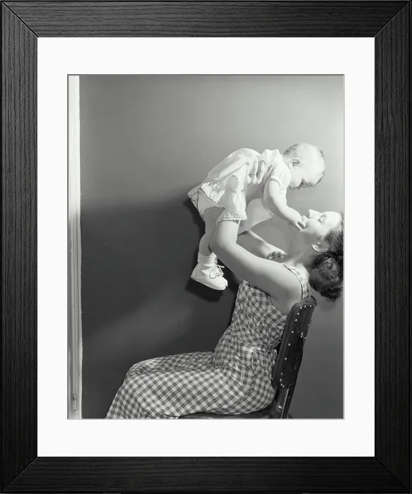 Framed Print : Young woman playing with her daughter