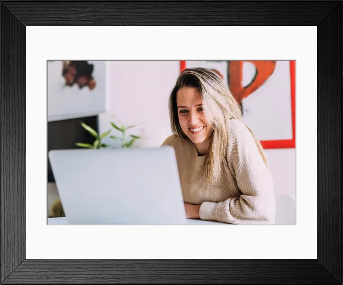 Framed Print : Italy, Young woman using laptop at home Framed Print : Italy, Young woman using laptop at home