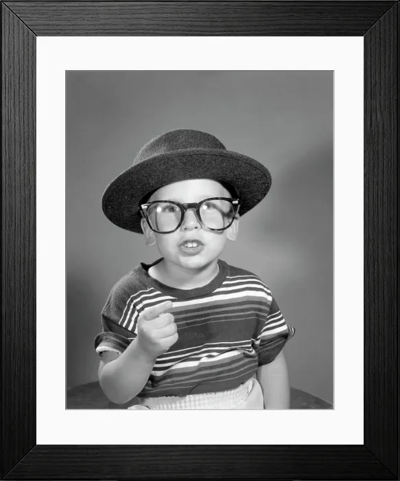 Framed Print : 1950S Portrait Boy Dressing Up In Adult Business Man'S Hat And Glasses Wearing Striped Tee Shirt Framed Print : 1950S Portrait Boy Dressing Up In Adult Business Man'S Hat And Glasses Wearing Striped Tee Shirt