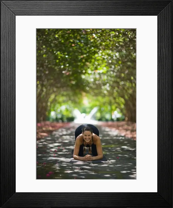 Framed Print : Young woman practicing yoga in park Framed Print : Young woman practicing yoga in park