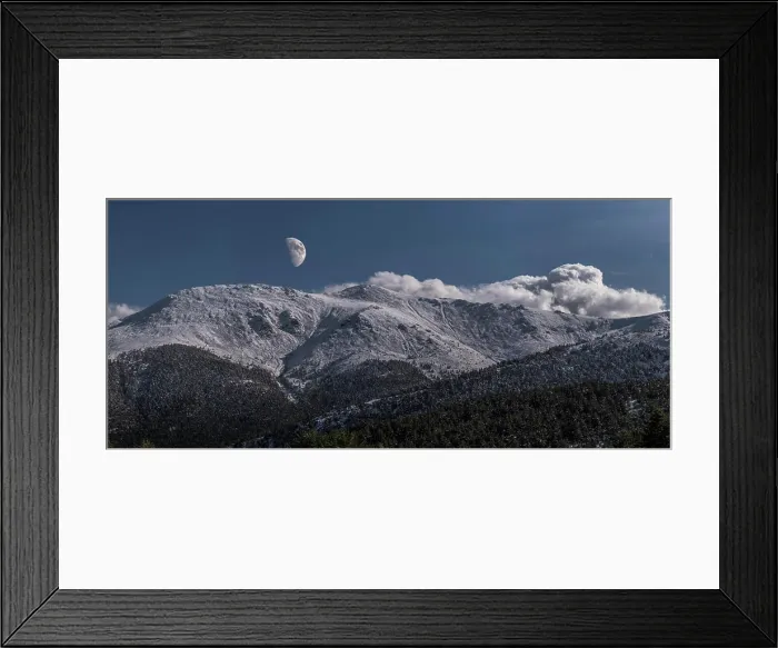 Framed Print : Breathtaking wide angle view of snowy mountain range against evening sky with white clouds and moon in nature Framed Print : Breathtaking wide angle view of snowy mountain range against evening sky with white clouds and moon in nature