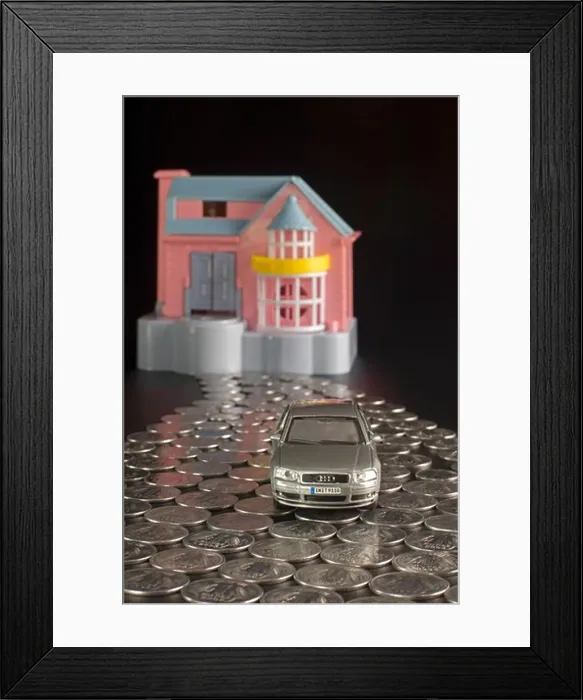 Framed Print : Doll house and toy car with indian rupee coins in a shape of a road Framed Print : Doll house and toy car with indian rupee coins in a shape of a road