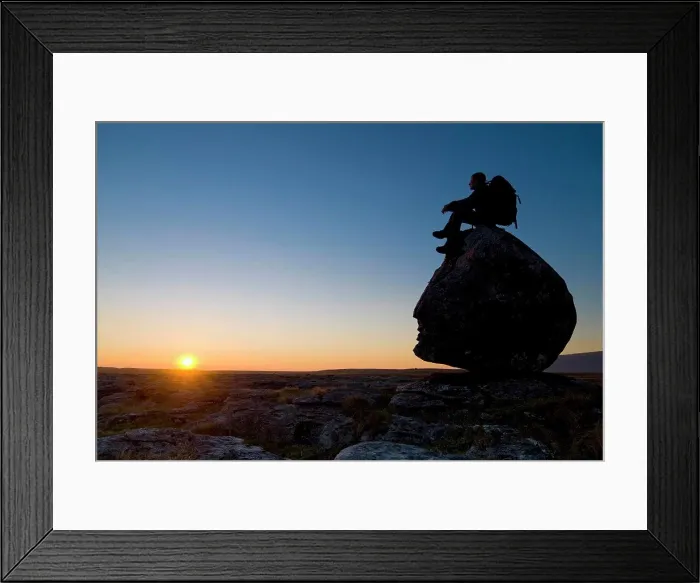 Framed Print : Hiker sitting on head-shaped boulder Framed Print : Hiker sitting on head-shaped boulder