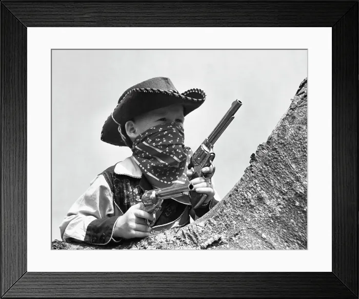 Framed Print : Boy dressed as cowboy