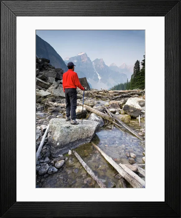 Framed Print : Hiker on Moraine Creek with Wenkchemna mountain range background, Banff National Park, Alberta, Canada Framed Print : Hiker on Moraine Creek with Wenkchemna mountain range background, Banff National Park, Alberta, Canada