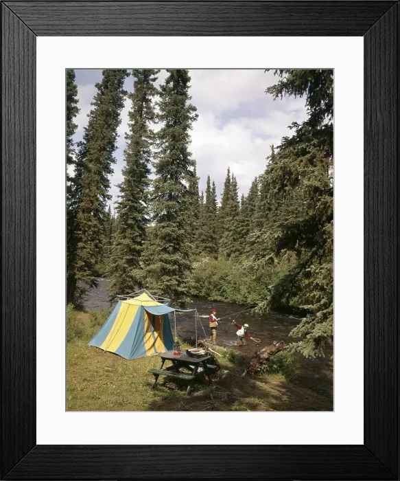 Framed Print : 1970s COUPLE MAN WOMAN FISHING IN STREAM CAMPSITE WITH TENT