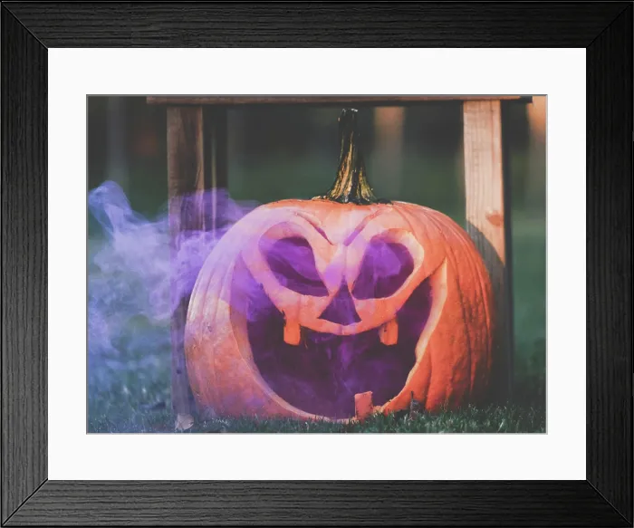Framed Print : Purple smoke in Jack o Lantern pumpkin face for Halloween holiday Framed Print : Purple smoke in Jack o Lantern pumpkin face for Halloween holiday