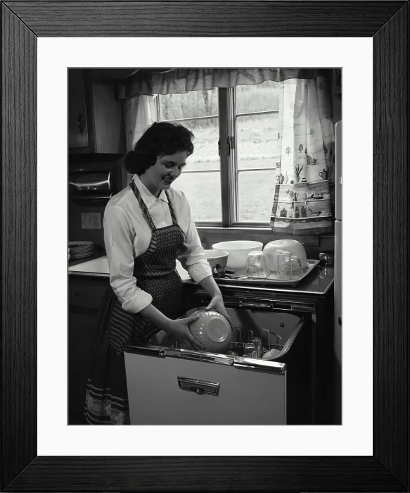 Framed Print : Young woman working in a kitchen Framed Print : Young woman working in a kitchen