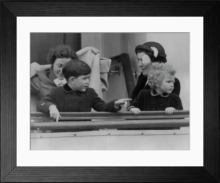 Framed Print : Princess Anne follows the painting finger of Prince Charles on board the new Royal yacht Britannia in Portsmouth Framed Print : Princess Anne follows the painting finger of Prince Charles on board the new Royal yacht Britannia in Portsmouth
