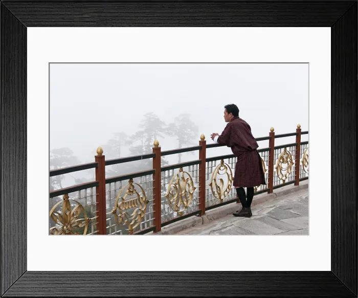 Framed Print : Asia, Bhutan, Dochu La. Man wearing traditional Gho garb looking into fog-shrouded trees. (MR) Framed Print : Asia, Bhutan, Dochu La. Man wearing traditional Gho garb looking into fog-shrouded trees. (MR)