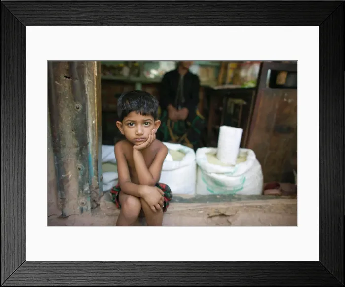 Framed Print : Young boy, Sukrabad, outside of Dhaka, Bangladesh. (NGO Restrictions May Apply)