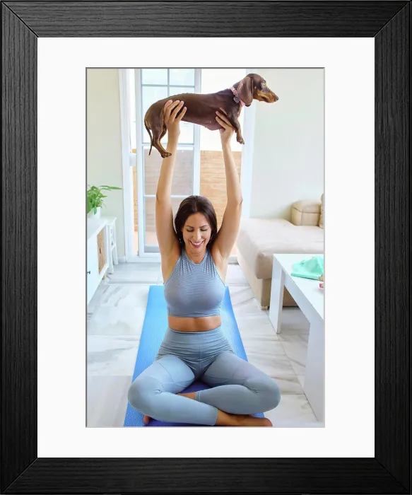 Framed Print : young woman doing sports at home with pet Framed Print : young woman doing sports at home with pet