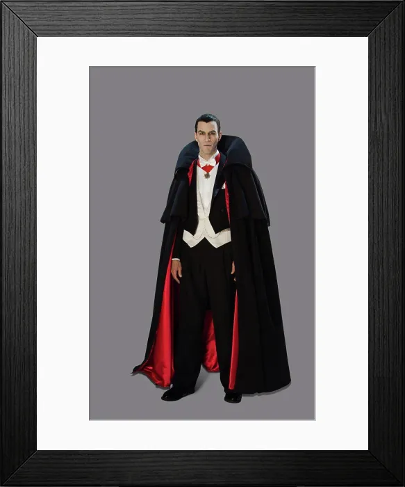 Framed Print : Full length portrait of a man dressed up as a vampire looking directly into camera with a spooky expression Framed Print : Full length portrait of a man dressed up as a vampire looking directly into camera with a spooky expression