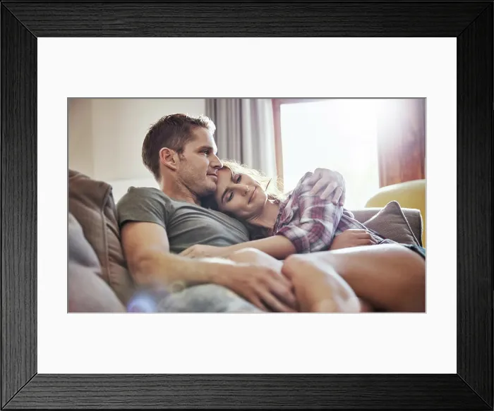 Framed Print : Peace, couple and relax on sofa with hug in living room for commitment Framed Print : Peace, couple and relax on sofa with hug in living room for commitment