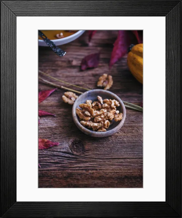Framed Print : Walnuts in a little bowl on a rustic wooden table Framed Print : Walnuts in a little bowl on a rustic wooden table