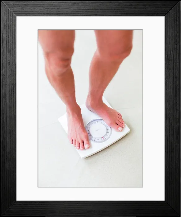 Framed Print : Man on a scale Framed Print : Man on a scale