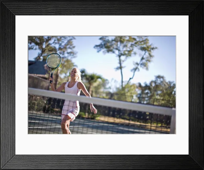 Framed Print : Young woman playing tennis Framed Print : Young woman playing tennis