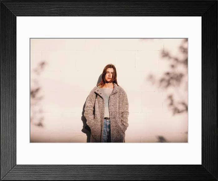 Framed Print : Portrait of transgender woman standing against wall in city Framed Print : Portrait of transgender woman standing against wall in city